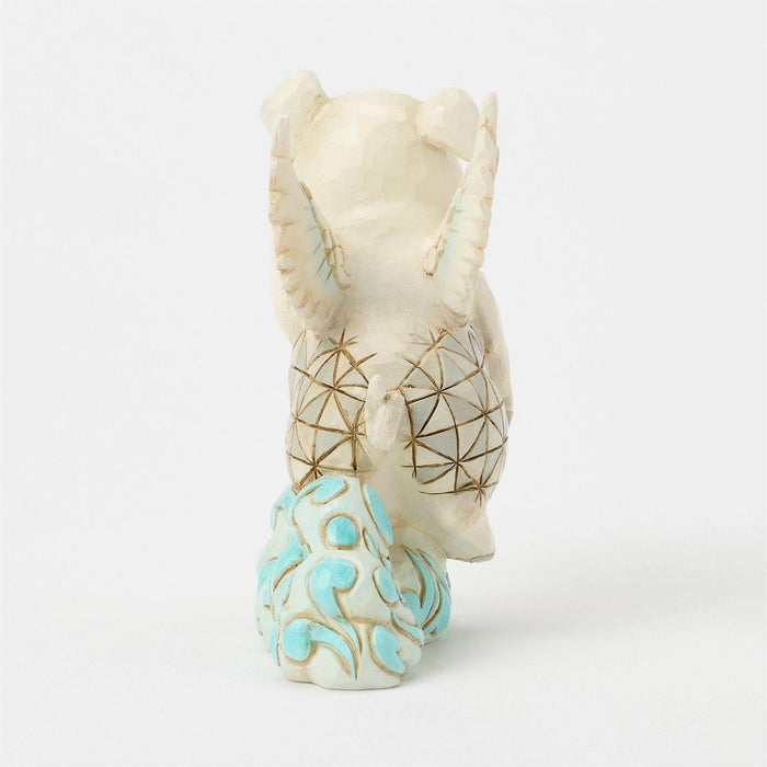 Decorative ceramic vase with geometric patterns on a white background