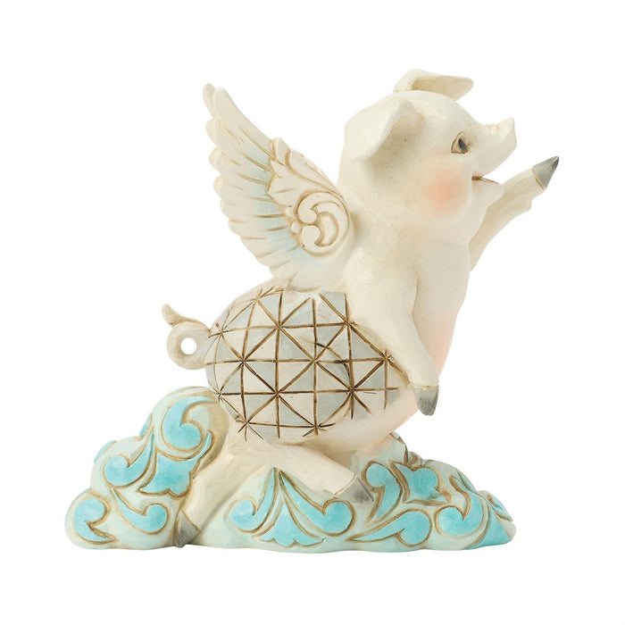 Decorative figurine of a pig with wings on a cloud