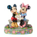 Figurine of Mickey and Minnie Mouse with flowers on a decorative base
