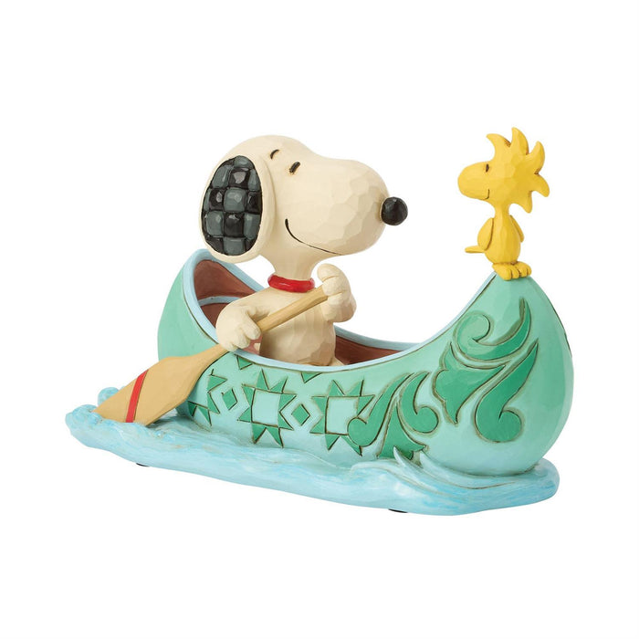 Snoopy and Woodstock in a canoe with decorative elements on a white background