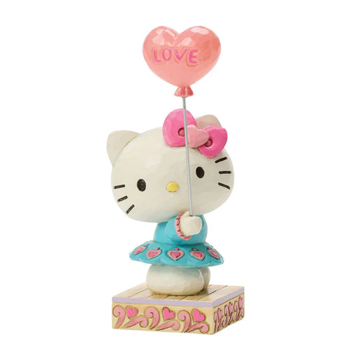 Hello Kitty figurine holding a heart-shaped balloon with 'LOVE' on a white background