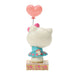 Hello Kitty figurine with a pink heart balloon on a white background