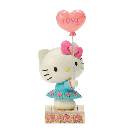 Hello Kitty figurine holding a heart-shaped balloon with 'LOVE' on a white background