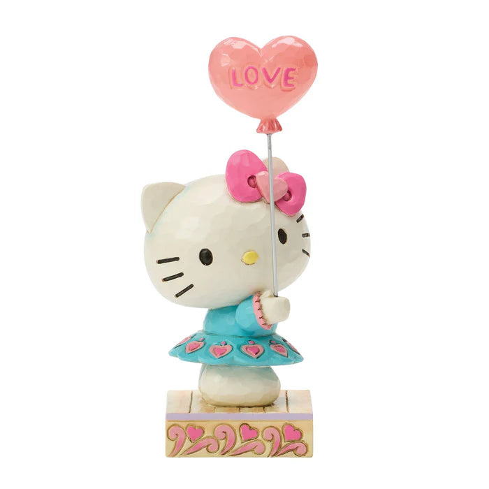 Hello Kitty figurine holding a heart-shaped balloon with 'LOVE' on a white background