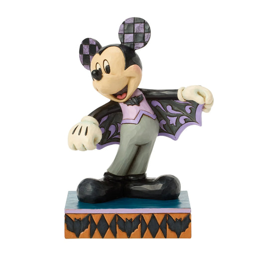 Mickey Mouse Halloween costume figurine with bat wings on a white background