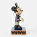 Mickey Mouse figurine in Halloween costume on a white background