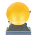 Figurine with a large yellow ball on a white background