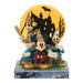 Disney Halloween-themed figurine with characters in front of a haunted house backdrop