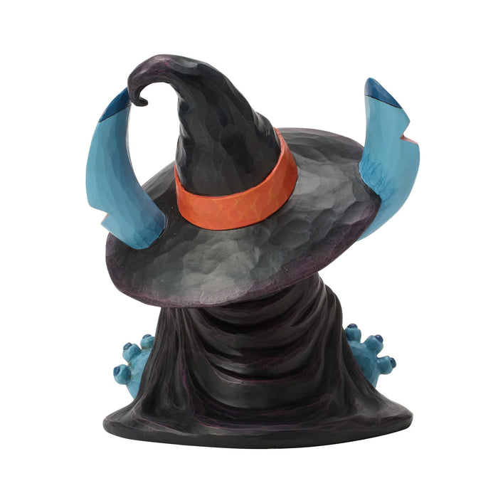 Witch hat figurine with blue accents and an orange band on a white background