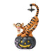 Tigger figurine on a Halloween pumpkin with a bat on a white background