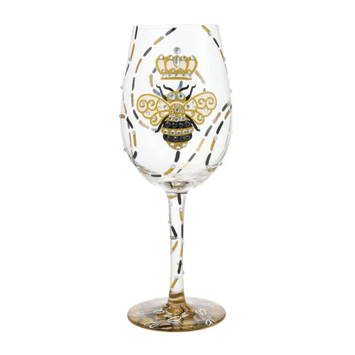 Wine glass with bee design and crown on a white background