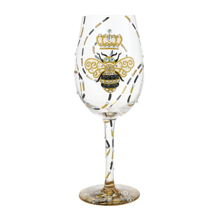 Wine glass with bee design and crown on a white background