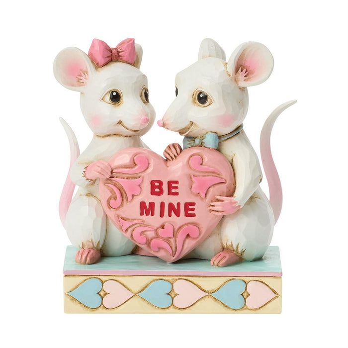 Two decorative mice holding a heart with 'Be Mine' text on a white background