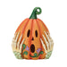 Decorative pumpkin with skeleton hands and floral designs on a white background