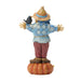 Scarecrow figurine with a bird on a white background