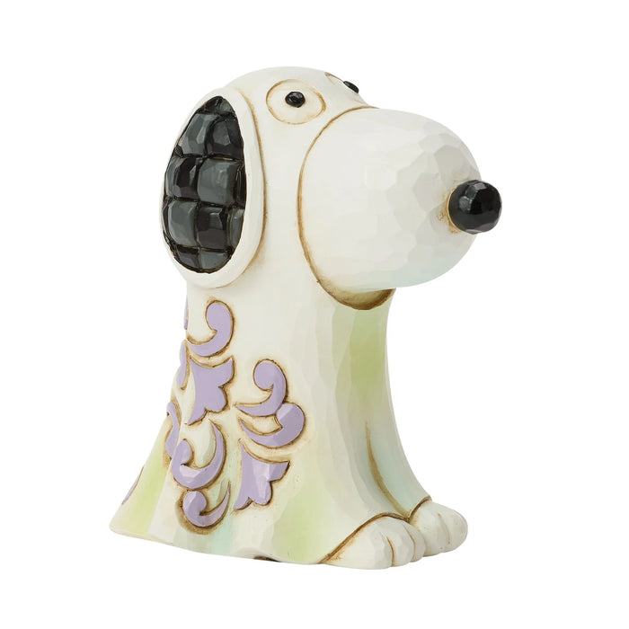 Decorative dog figurine with intricate patterns on a white background