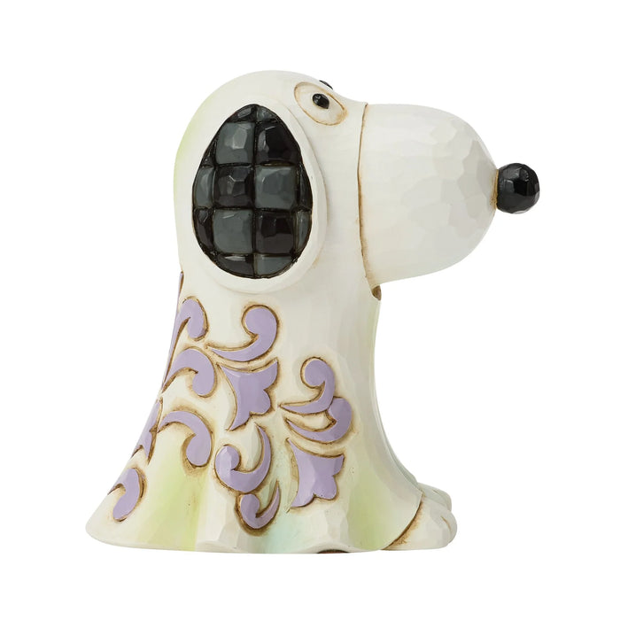 Decorative dog figurine with intricate patterns on a white background
