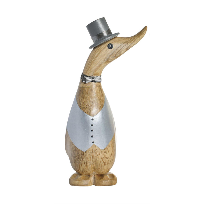 Decorative wooden duck figurine wearing a top hat and vest on a white background