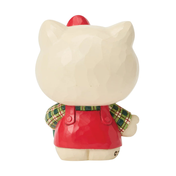 Cat-shaped figurine with a red outfit and plaid shirt on a white background