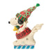Decorative figurine of a dog wearing a festive hat and scarf on a white background