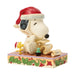 Snoopy figurine with a Santa hat and Woodstock on a decorative base
