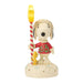 Figurine of Snoopy holding a striped pole with a yellow star on a white background