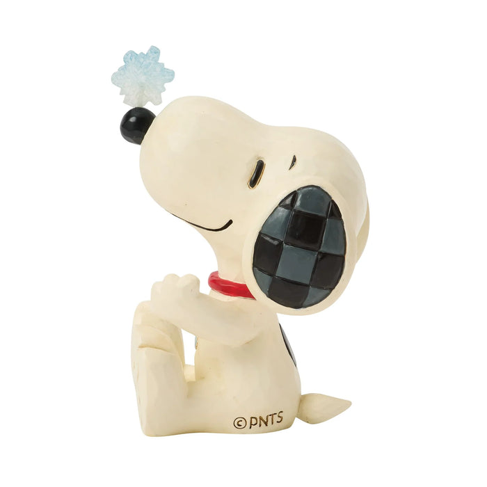 Snoopy figurine with a snowflake on a white background