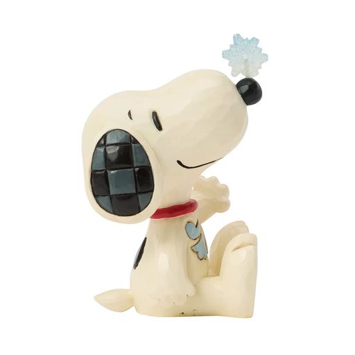 Snoopy figurine with a snowflake on a white background