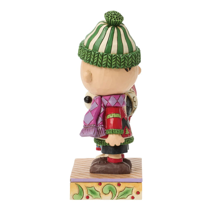 Figurine of a character wearing a green and white striped hat and colorful outfit on a white background