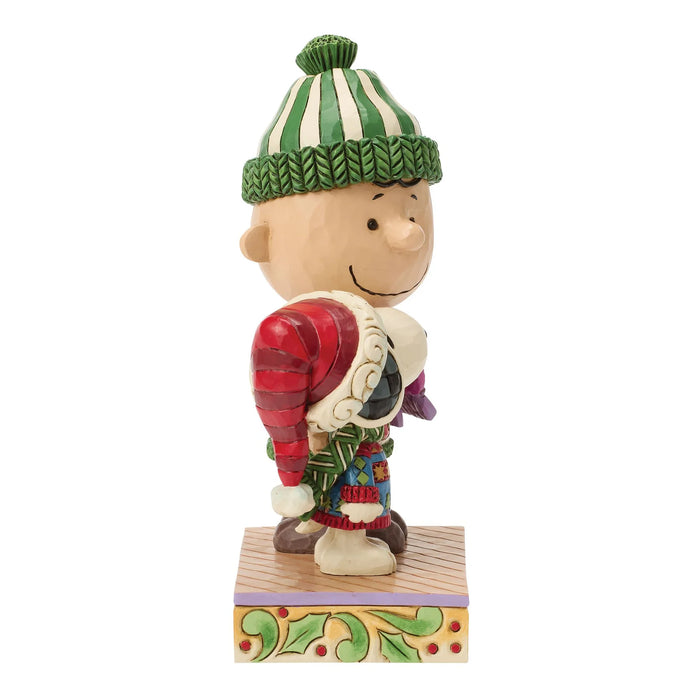 Colorful figurine of a character wearing a striped hat and colorful outfit on a white background