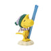 Yellow bird figurine with a green hat and blue skis on a white background