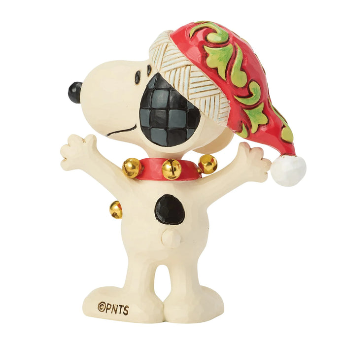 Snoopy figurine with a festive hat on a white background
