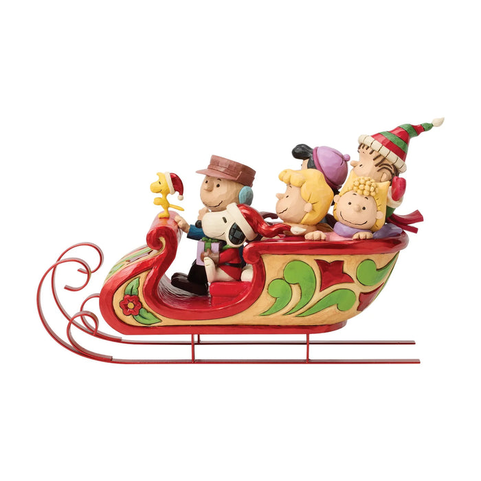 Peanuts characters in a festive sleigh figurine