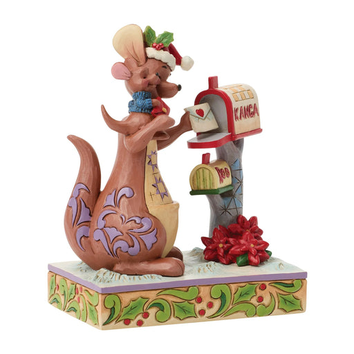 Decorative figurine of a mouse with a Christmas hat, letter, and mailbox on a white background