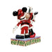 Figurine of a character in a Santa Claus outfit on a decorative base with holly design.