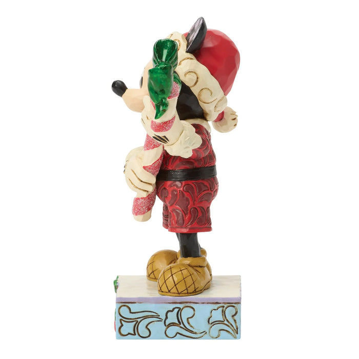 Animated character figurine holding a tomato on a white background