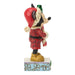 Animated character figurine with red outfit and helmet on a white background
