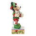 Decorative figurine of a character in festive attire holding a lantern on a white background