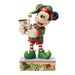 Animated character figurine dressed as an elf holding a small train on a white background