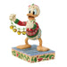 Colorful figurine of a cartoon character holding bells on a decorative base.