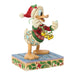 Christmas-themed figurine of a duck wearing a sweater and Santa hat with bells, on a decorative base.