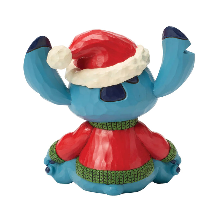 Blue cartoon character with a red hat and sweater on a white background