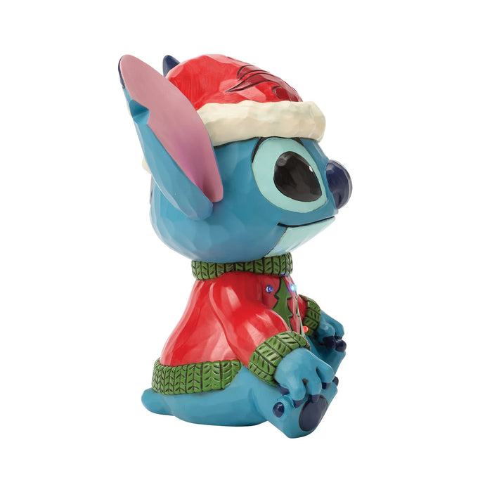 Animated character figurine wearing a festive outfit on a white background