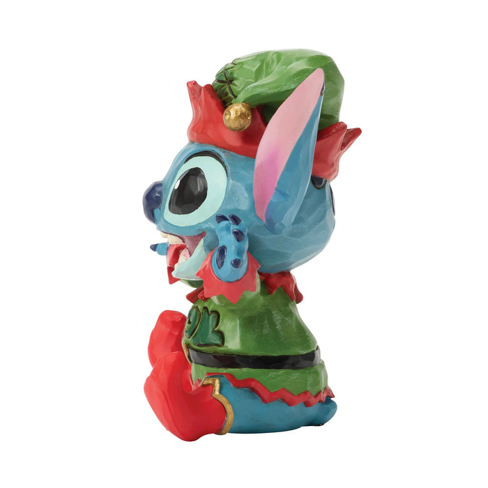 Colorful figurine with a green hat and red accents on a white background