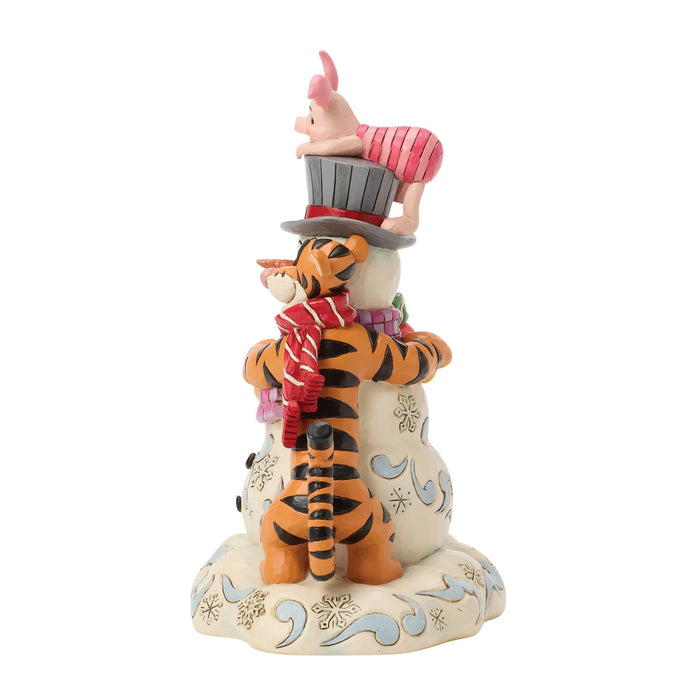 Animated character figurine with a hat and scarf on a white background