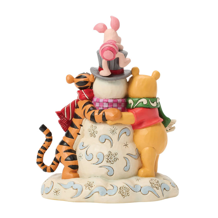 Figurine of Winnie the Pooh, Piglet, and Tigger on a white background