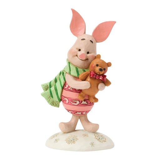 Figurine of a cartoon character holding a teddy bear on a white background