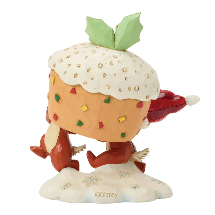Animated character figurine with a cupcake-like head and red scarf, standing on a white base with Disney logo.