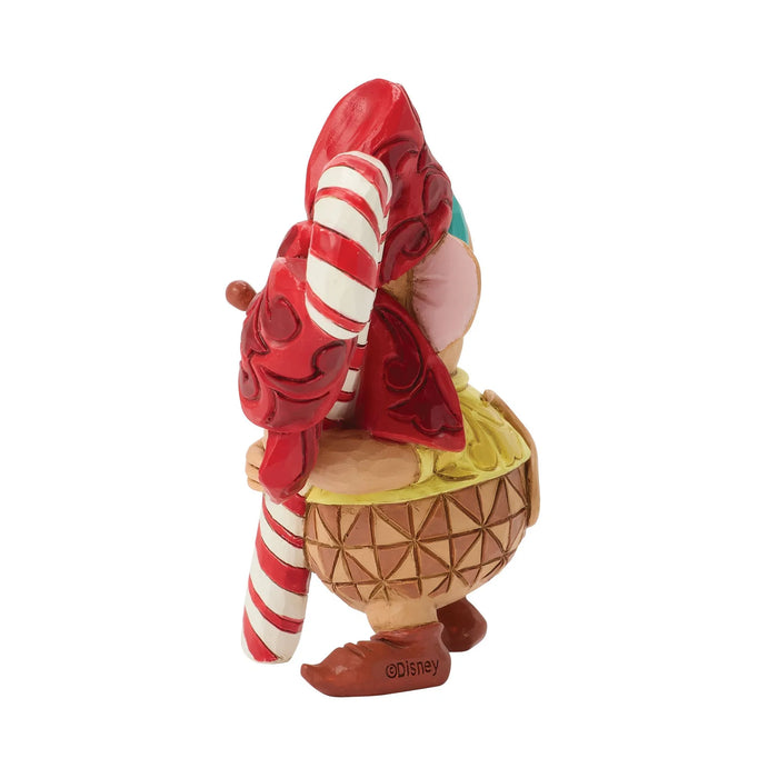 Animated character figurine with a pineapple shell and candy cane on a white background