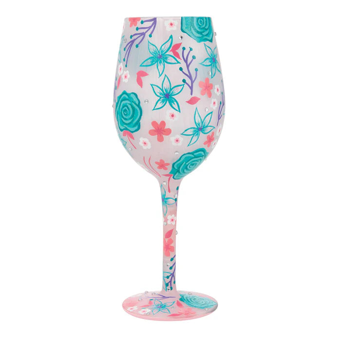 Wine glass with floral design on a white background